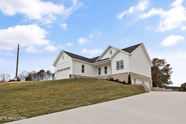 view of home's exterior featuring a lawn, concrete driveway, and an attached garage