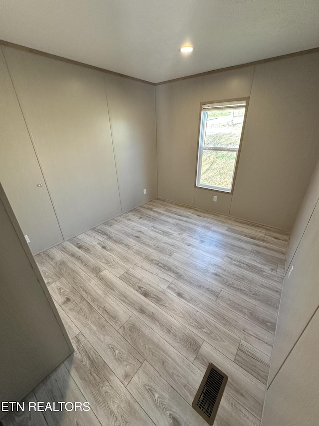 empty room featuring light hardwood / wood-style floors