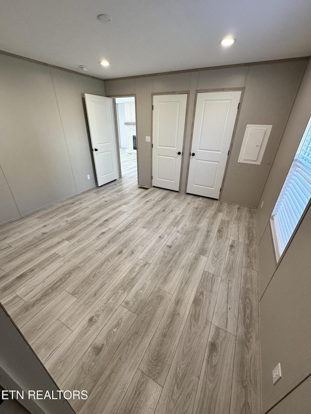 unfurnished bedroom with light wood-type flooring