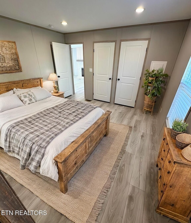 bedroom with light hardwood / wood-style floors