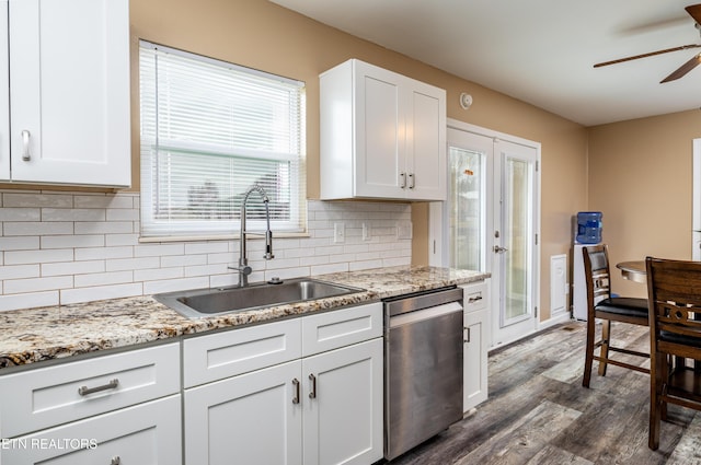 kitchen with sink, stainless steel dishwasher, ceiling fan, dark hardwood / wood-style flooring, and white cabinetry