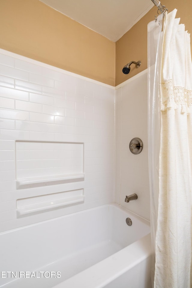 bathroom featuring shower / bathtub combination with curtain