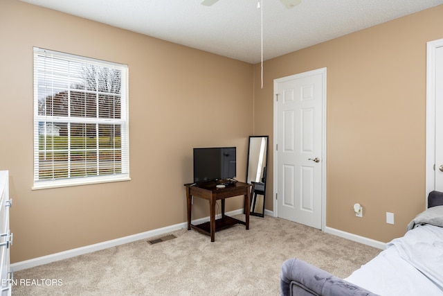 carpeted bedroom featuring ceiling fan