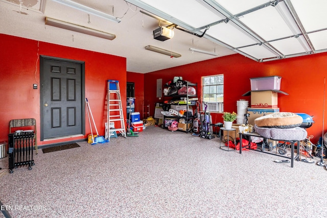 garage with electric panel and a garage door opener