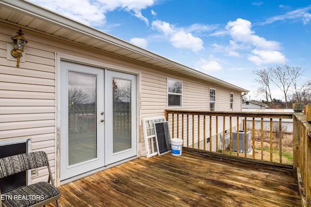 deck with french doors and central AC unit