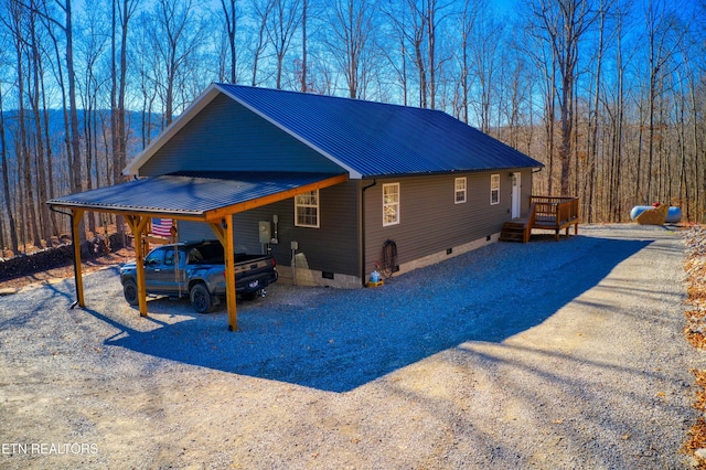 view of side of home with a carport