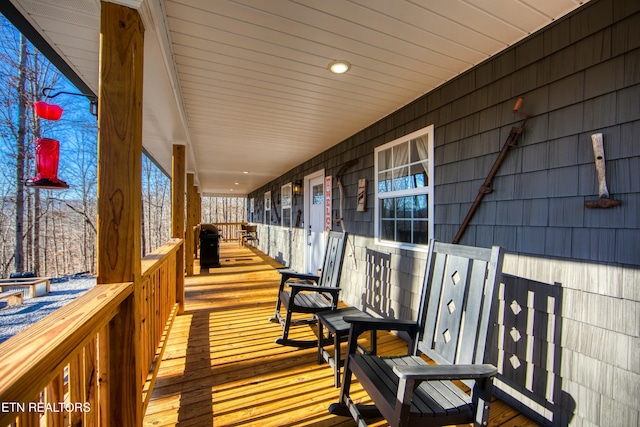 wooden deck featuring covered porch