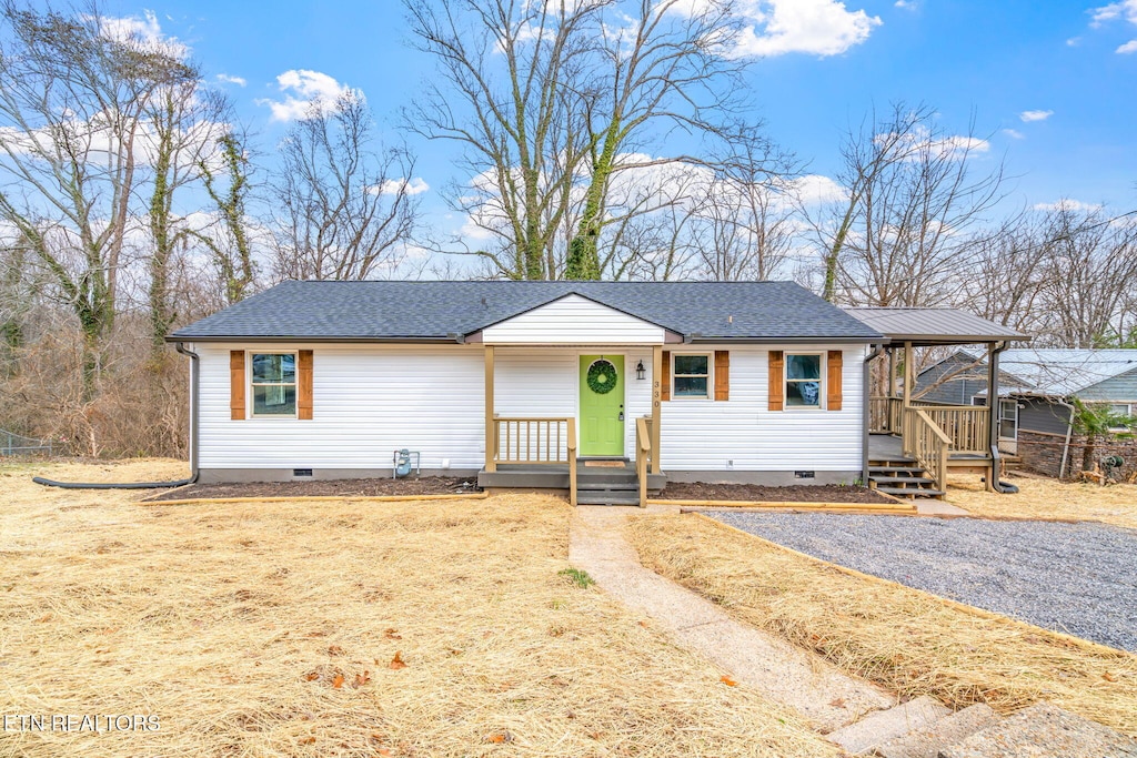 ranch-style home with crawl space, a shingled roof, and a porch