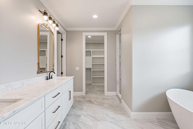 bathroom with a bath, vanity, and ornamental molding