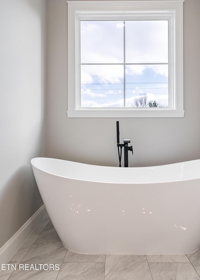 bathroom with a washtub