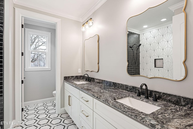 bathroom featuring vanity, toilet, tiled shower, and crown molding