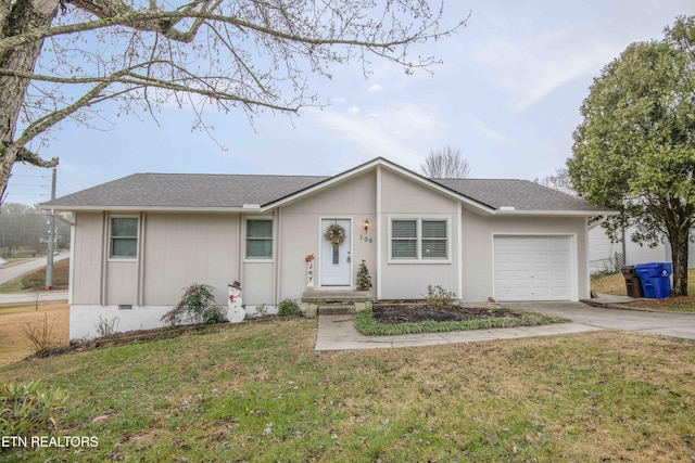 single story home featuring a garage and a front lawn