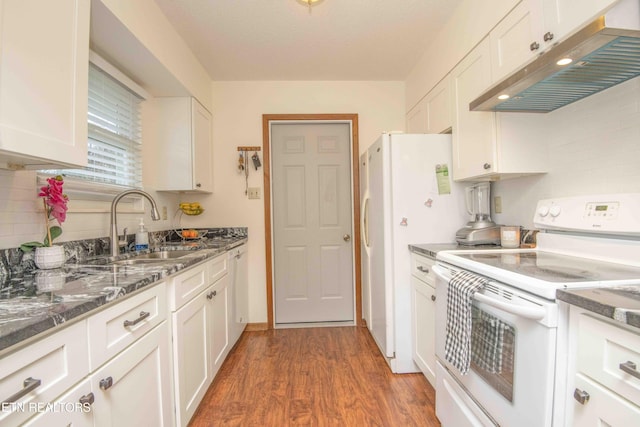 kitchen featuring white cabinets, white appliances, dark hardwood / wood-style floors, and sink