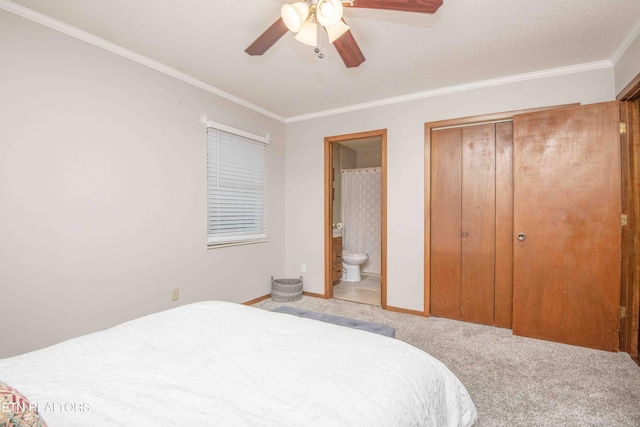 bedroom featuring connected bathroom, light colored carpet, ceiling fan, and ornamental molding