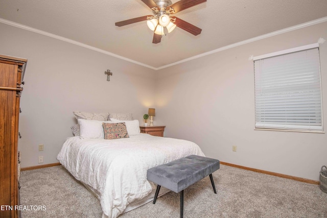 bedroom with ceiling fan, carpet floors, and ornamental molding