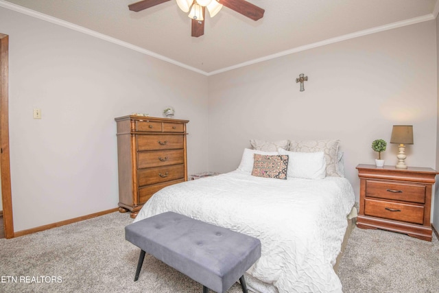 bedroom featuring ceiling fan, ornamental molding, and light carpet