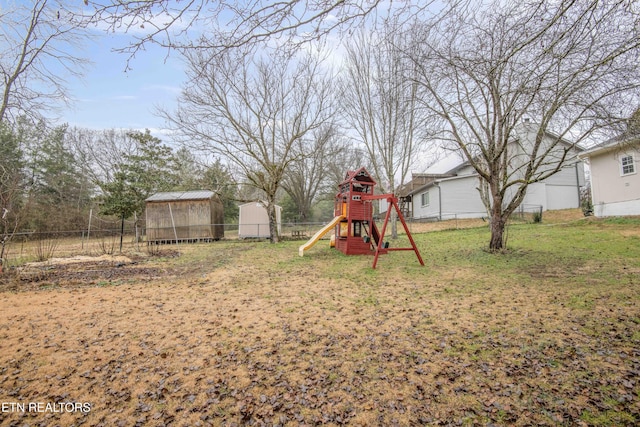 view of yard with a playground and an outdoor structure