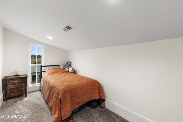 carpeted bedroom featuring vaulted ceiling