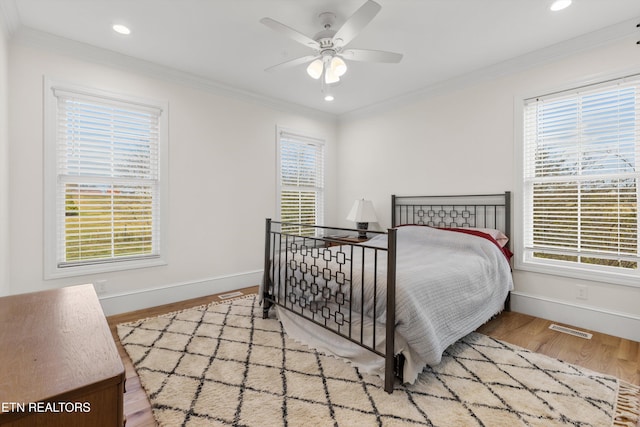 1430 Maple Ln, Greenback, TN 37742 - bedroom featuring baseboards, multiple windows, ornamental molding, wood finished floors, and recessed lighting
