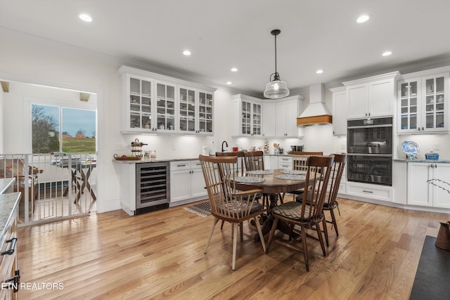 1430 Maple Ln, Greenback, TN 37742 - dining area with wine cooler, recessed lighting, light wood-style flooring, ornamental molding, and bar area
