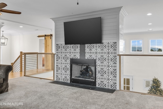1430 Maple Ln, Greenback, TN 37742 - carpeted living room featuring a barn door, a ceiling fan, recessed lighting, crown molding, and a fireplace