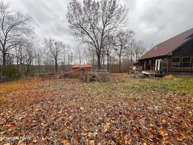 view of yard featuring a wooden deck