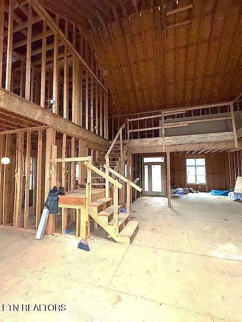 miscellaneous room featuring lofted ceiling