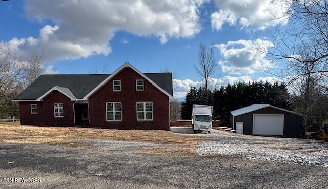 view of front of home with an outbuilding and a garage