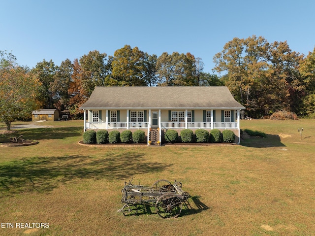 ranch-style house with a porch and a front lawn