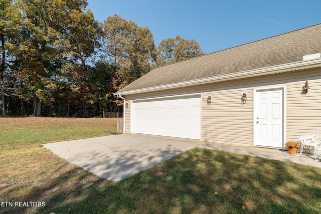 garage with a lawn