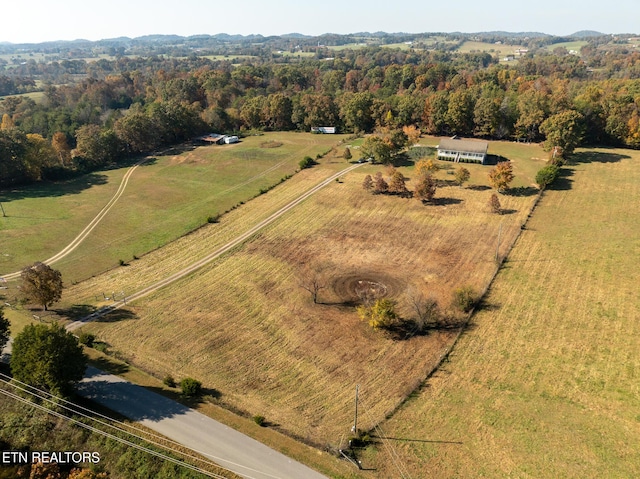 birds eye view of property featuring a rural view