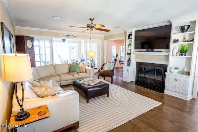 living room featuring crown molding, dark hardwood / wood-style flooring, and ceiling fan