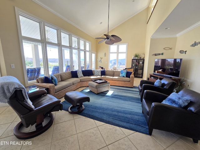 living room featuring high vaulted ceiling, ceiling fan, crown molding, and light tile patterned flooring