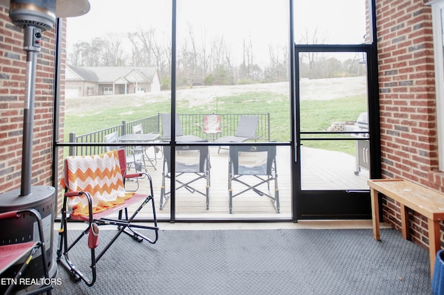 unfurnished sunroom with a wealth of natural light