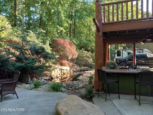 view of patio / terrace featuring an outdoor bar