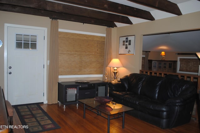 living room with vaulted ceiling with beams and dark hardwood / wood-style floors