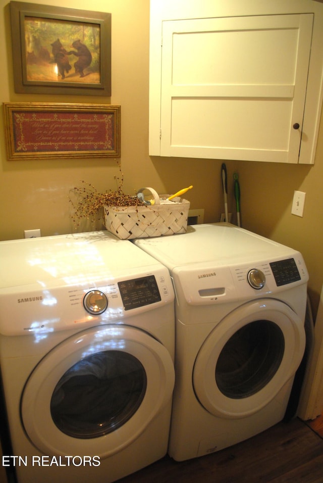 laundry area featuring cabinets and washing machine and clothes dryer