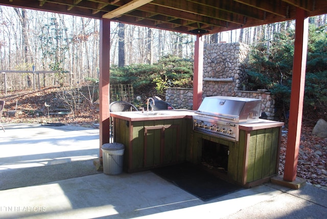 view of patio / terrace featuring area for grilling, grilling area, and sink