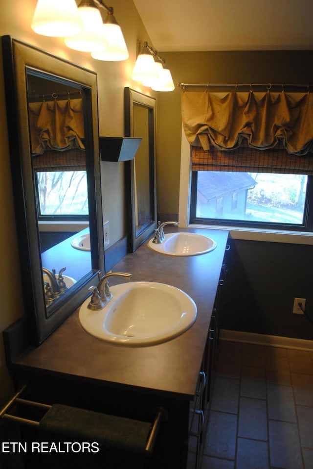 bathroom featuring tile patterned flooring and vanity