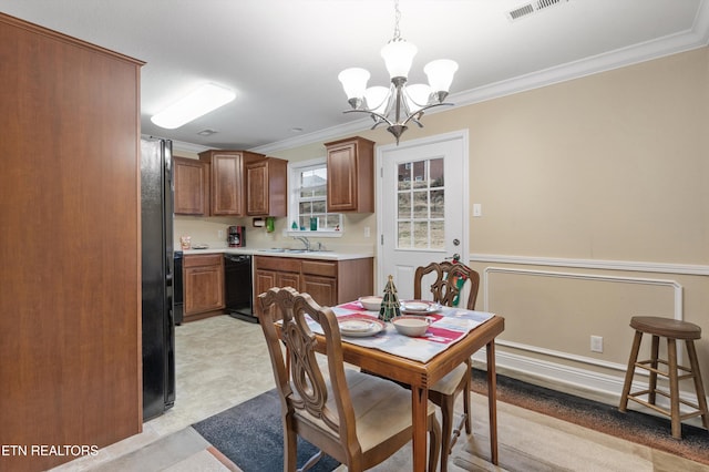 dining space featuring crown molding, sink, light carpet, and a notable chandelier