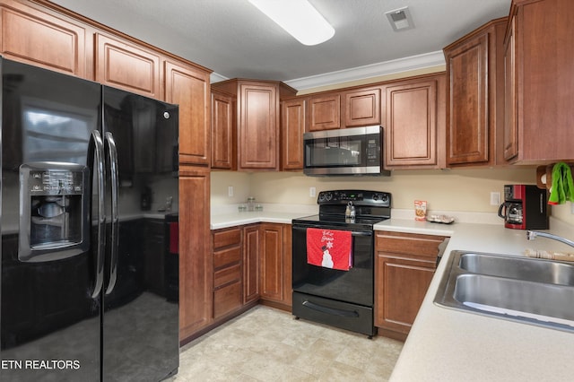 kitchen featuring crown molding, sink, black appliances, and a textured ceiling