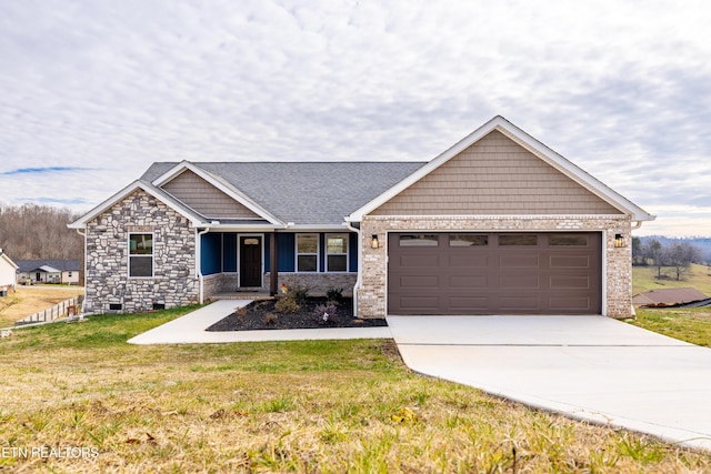 craftsman-style home featuring a front lawn and a garage