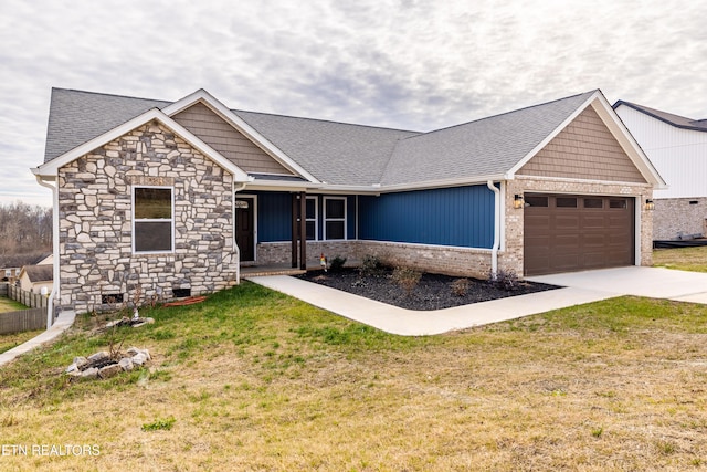 craftsman-style home with a front yard and a garage