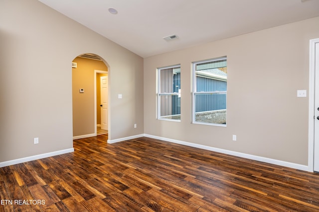 empty room featuring dark wood-type flooring