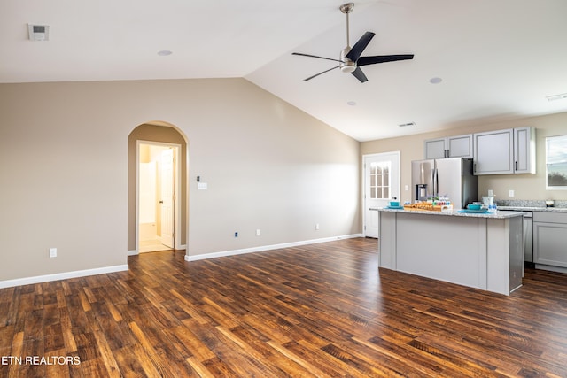 kitchen with ceiling fan, a center island, stainless steel fridge with ice dispenser, dark hardwood / wood-style floors, and gray cabinets