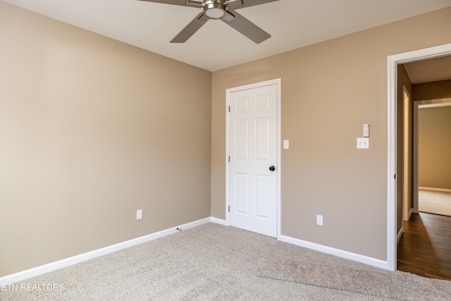 unfurnished bedroom featuring carpet floors and ceiling fan