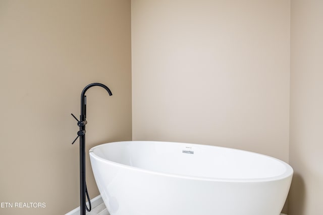 bathroom with a washtub