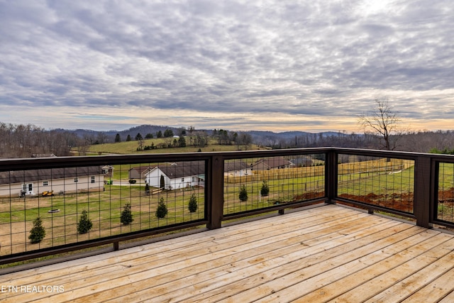 deck at dusk with a mountain view