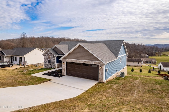 view of front of house with a front lawn and central AC unit