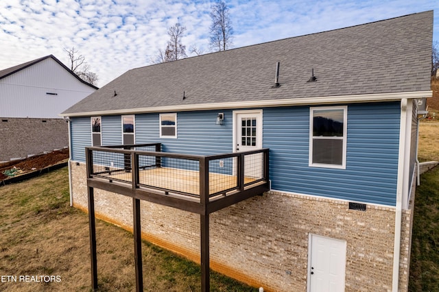 back of property featuring a deck